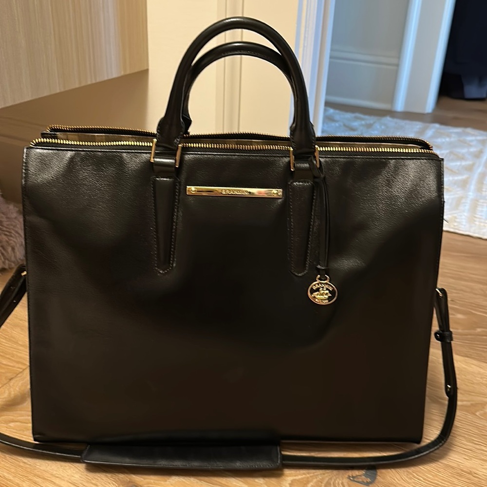 Authentic Brahmin black leather briefcase/tote with gold hardware and strap.